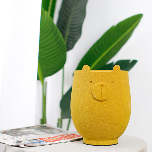 Little bear a flower pot