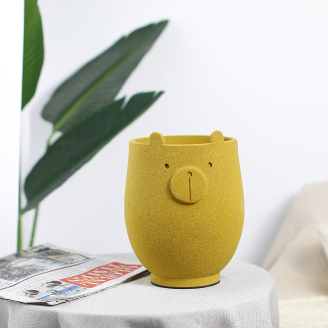 Little bear a flower pot